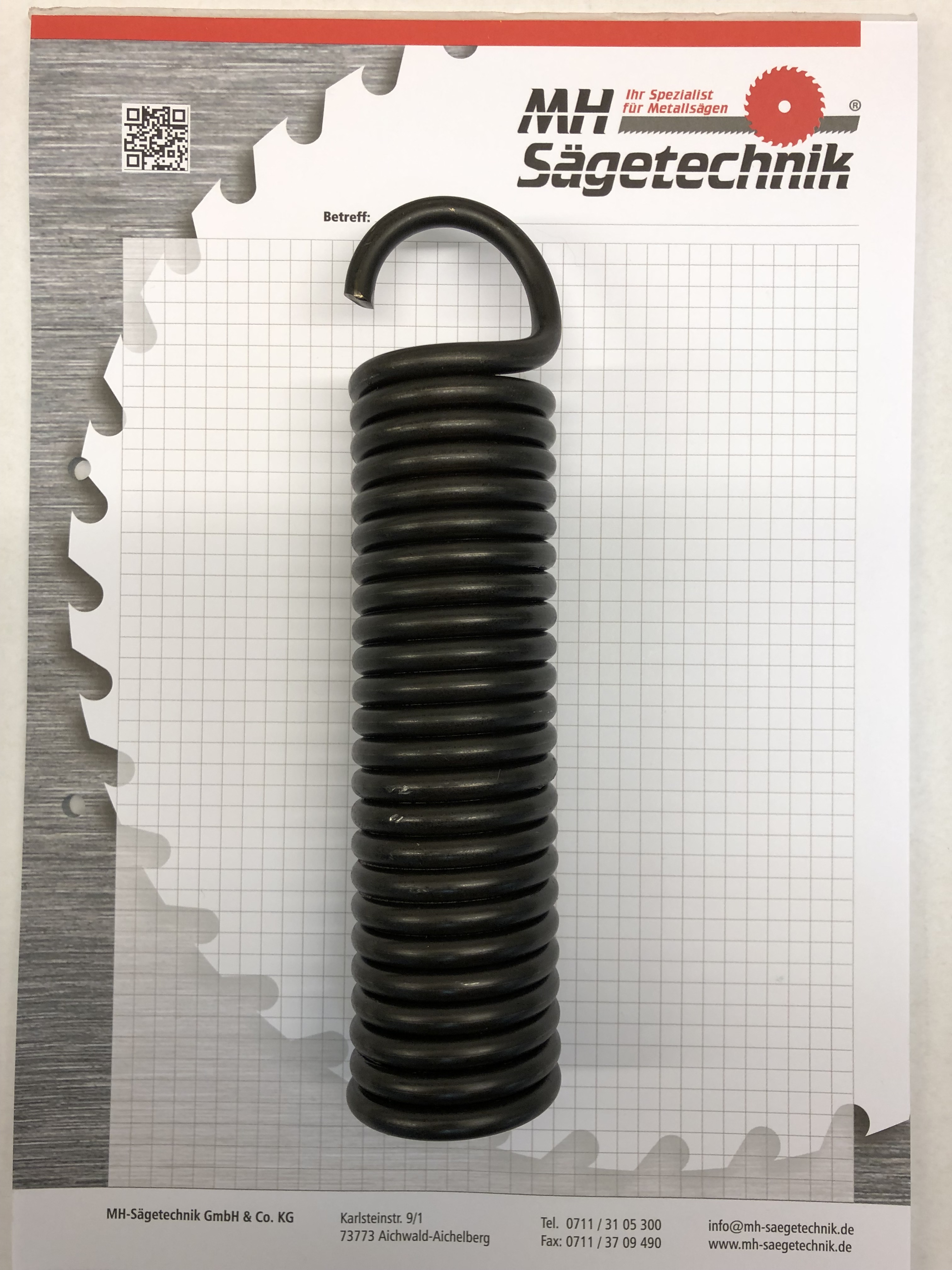 Rückholfeder mit einer Öse